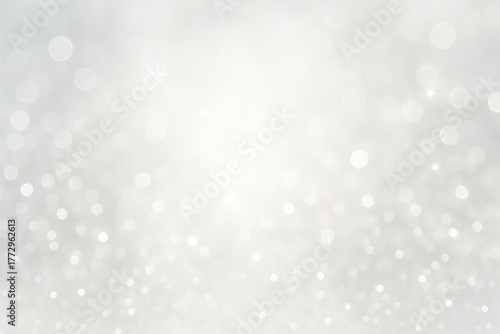 Elegant silver and white glittering bokeh background for festive holiday celebrations