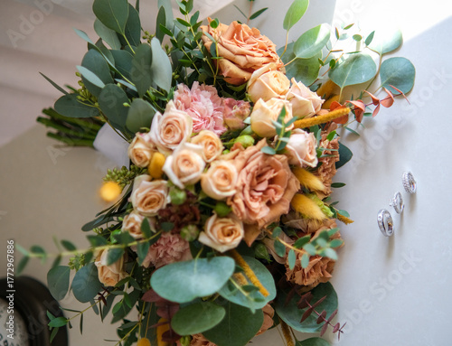 Rings, earrings, bouquet, bridal shoe