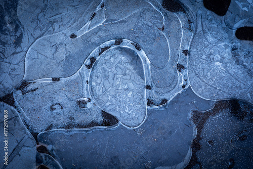 Beautiful ice patterns of a frozen lake. Winter scenery of Latvia.