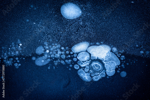 Beautiful ice patterns of a frozen lake. Winter scenery of Latvia.