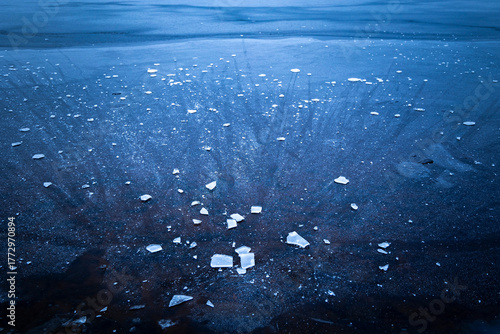 Beautiful ice patterns of a frozen lake. Winter scenery of Latvia.