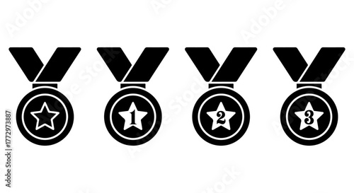 Four black and white medals with stars and numbers for first second and third place