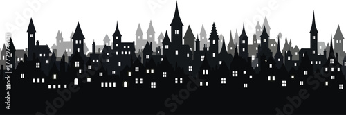 Dark silhouette of an old european city skyline with many buildings and lit windows at night