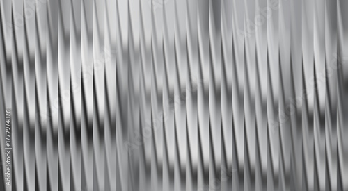 Abstract geometric metallic texture with a dynamic pattern creating depth and movement. A sleek, modern design evokes industrial appeal.