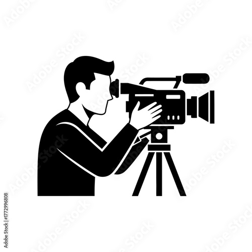 Man filming with professional camera on tripod.