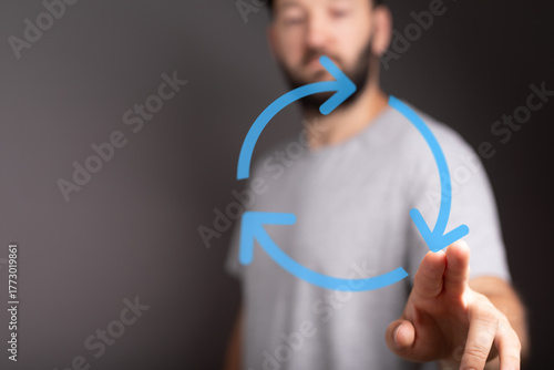 A man using his finger to i...