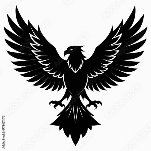 Majestic black silhouette of an eagle with wings spread wide in flight on a white background