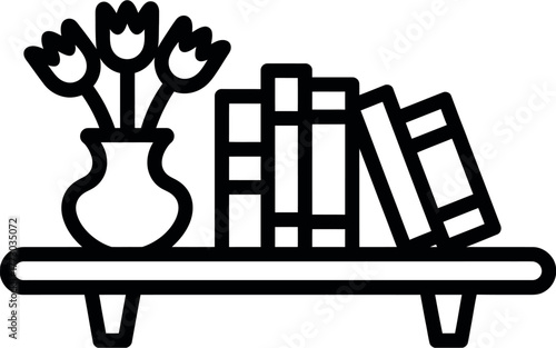 A vase of flowers sits on a shelf next to a row of books.