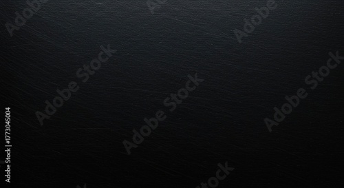 A close-up shot revealing the rough, matte finish and deep charcoal coloring of a thick industrial black steel plate ,construction ,sheet ,metallic