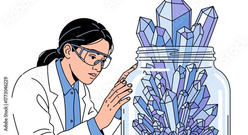 Scientist examining crystals growing in a jar.