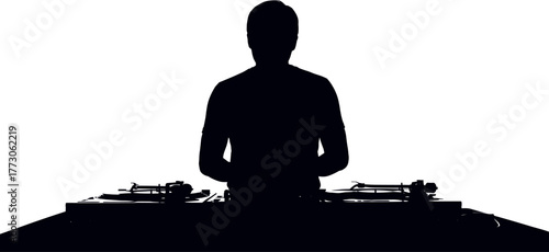 Silhouetted DJ Mixing Music at Turntables Nightlife Entertainment