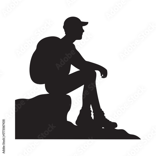 Silhouette of backpacker resting.