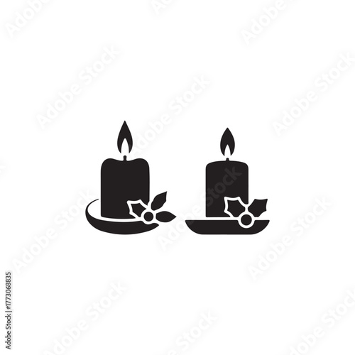 Two burning candles with holly decorations a simple black shape silhouette