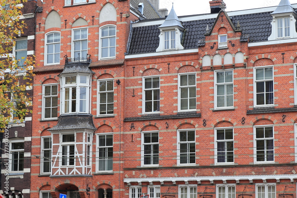 Fototapeta premium Marnistraat Red Brick Building Exterior in Amsterdam, Netherlands