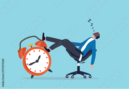 Afternoon slump, laziness and procrastination postpone work to do later, boredom and sleepy work concept, businessman sleeping lay down on office chair and alarm clock covered his face with book.