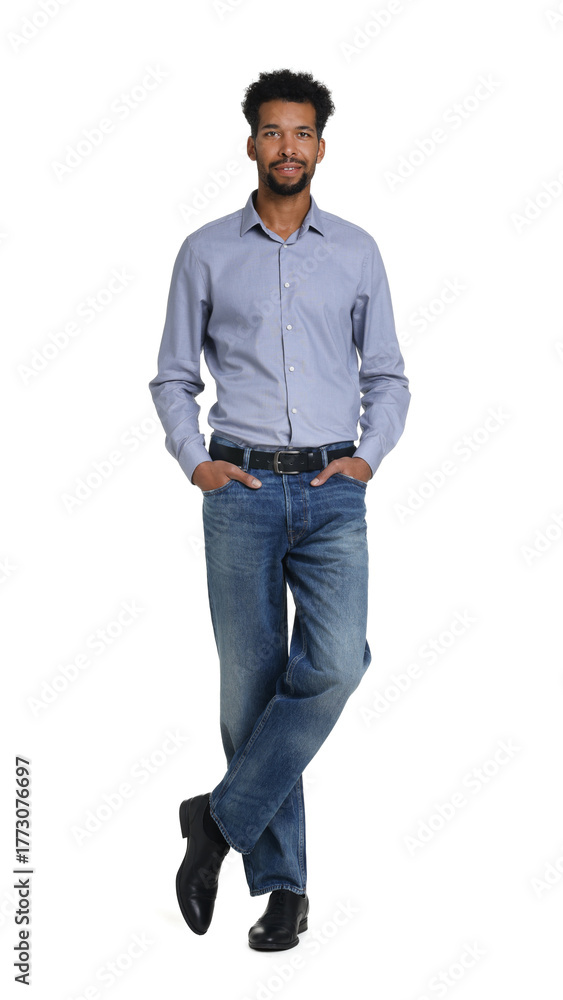 Naklejka premium Happy man wearing stylish jeans on white background