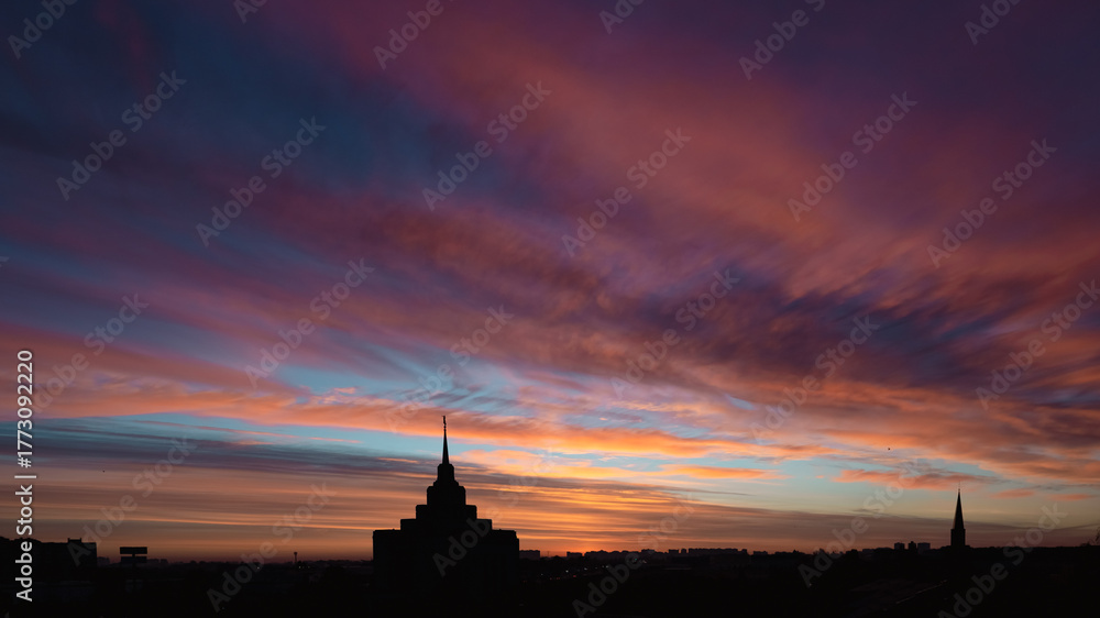 Obraz premium Skyline at sunrise. Colorful dawn. Sky of Ukraine. Mormon Church. European country. Megapolis Kyiv. Panorama of a big city. Sky gradient. Enchanting beauty of nature. Tourism in Europe. 