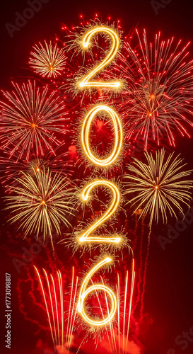 Happy New Year 2026. Vertical sparkler numbers against a festive red fireworks background.