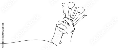 Hand holding a makeup brush, one continuous line outline isolated vector illustration Editable stroke.