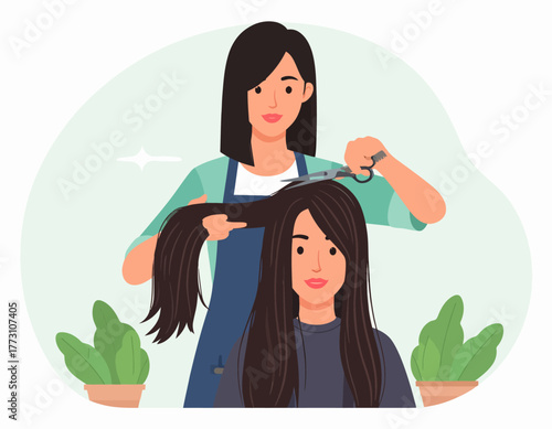 A female hairdresser cuts long dark hair of a young woman in a salon, with potted plants visible in the foreground.