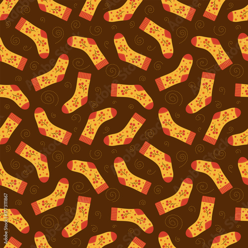 Seamless pattern with socks decorated with berries. Autumn motif in warm colors. Cotton and wool accessories. Vector illustration.