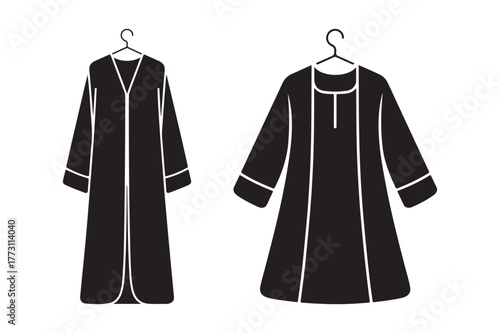 Two traditional black thobes hanging on hangers