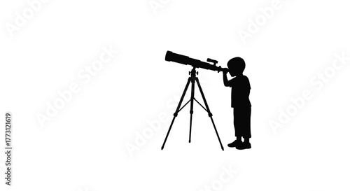 A silhouette of a young boy gazing through a telescope at the sky