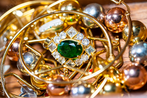 A variety of jewelry featuring gold, gemstones, silver, and pearls.