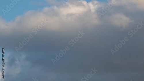  Bright clouds are flying across the sky. Timelapse 