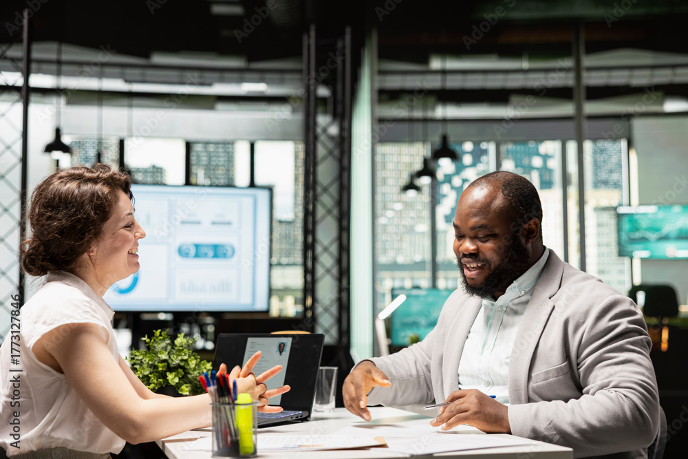 Fototapeta premium African american new hire signing work contract terms to start new job, receiving approval for onboarding within the enterprise. Recruiter finalizing the hiring process with legal paperwork.