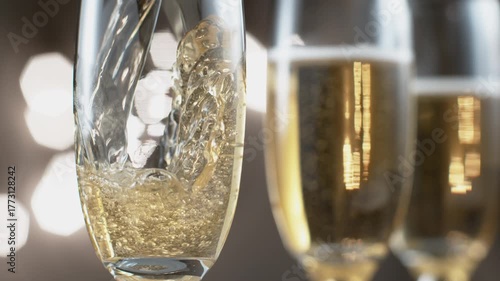 Pouring a glass of champagne at New Years party in slow motion