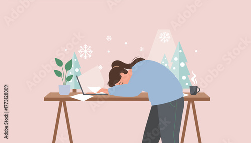 Exhausted woman asleep at her desk working on a laptop during the winter holidays Burnout concept