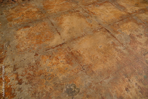 Wallpaper Mural Distressed concrete floor displaying a weathered grunge surface with oxidized brown and orange rust-like textures, creating an abstract industrial background Torontodigital.ca