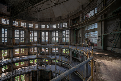 Wallpaper Mural Abandoned distillery tower in Italy – circular industrial building with glass dome, steel beams, panoramic windows, decaying factory interior, urban exploration, post-industrial architecture Torontodigital.ca