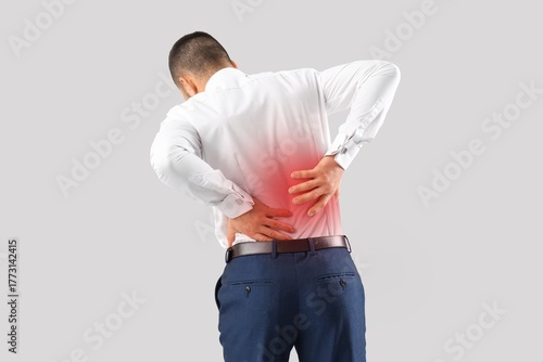 Young businessman suffering...