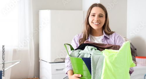Young woman holding basket ...