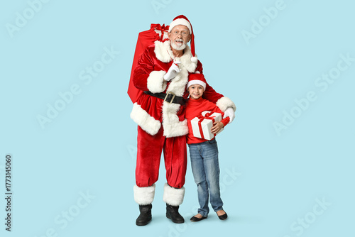 Santa Claus and cute little...