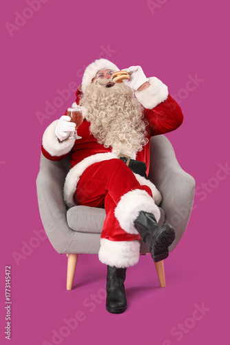 Santa Claus with glass of b...