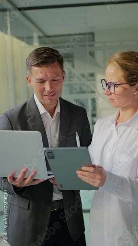 Business meeting with laptop discussion in office