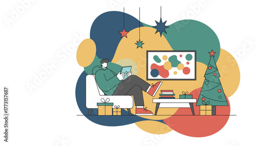 Relaxing man using tablet in a cozy decorated home during the holiday season