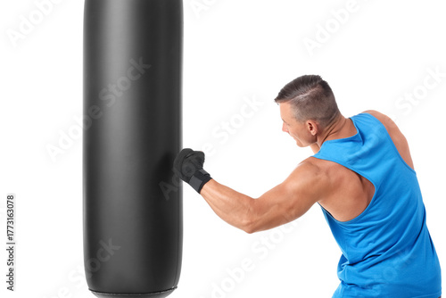 Male boxer punching bag on ...