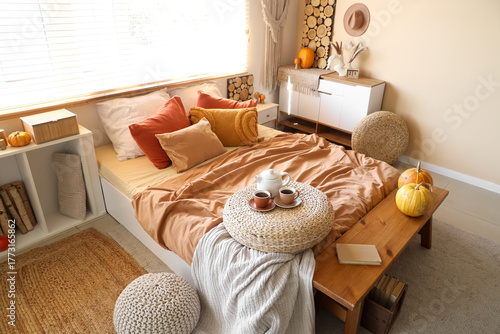 Wicker pouf with teapot and...