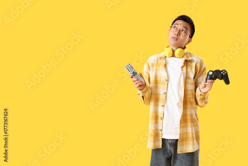 Thoughtful young Asian man ...