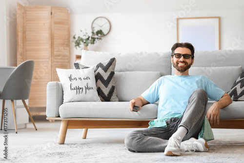 Young man in 3D glasses wit...
