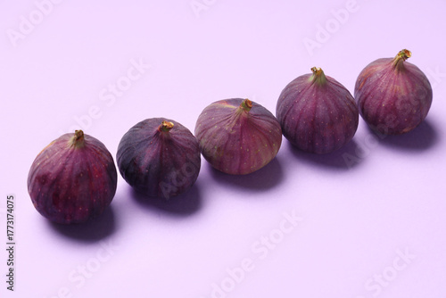 Five fresh ripe purple figs...
