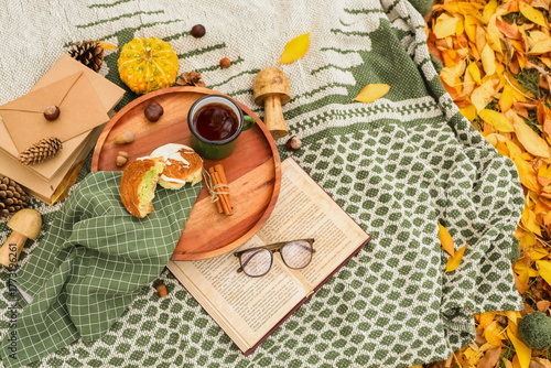 Cup of tea with cake, book ...