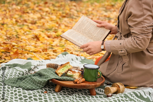 Young woman with cup of tea...