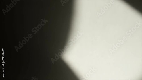 Abstract Light and Shadow Play on Textured Surface.