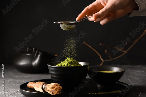 Woman sprinkling powdered m...