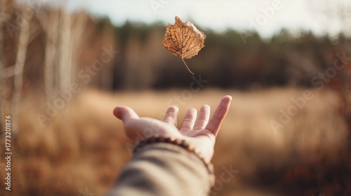 Person letting go of the past year, symbolic emotional release and new beginning gesture